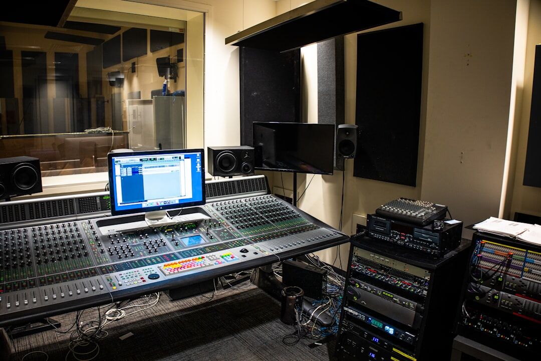 Multi-source mixing setup with multiple screens and equipment