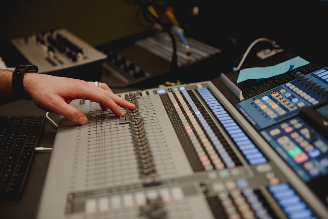 Broadcast engineer operating live production console